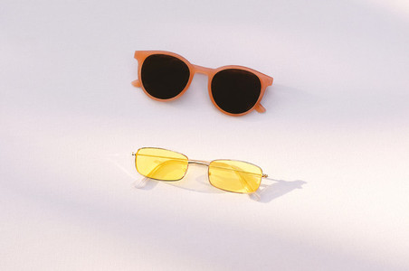 Flat lay summer fashion accessories concept of two sunglasses on