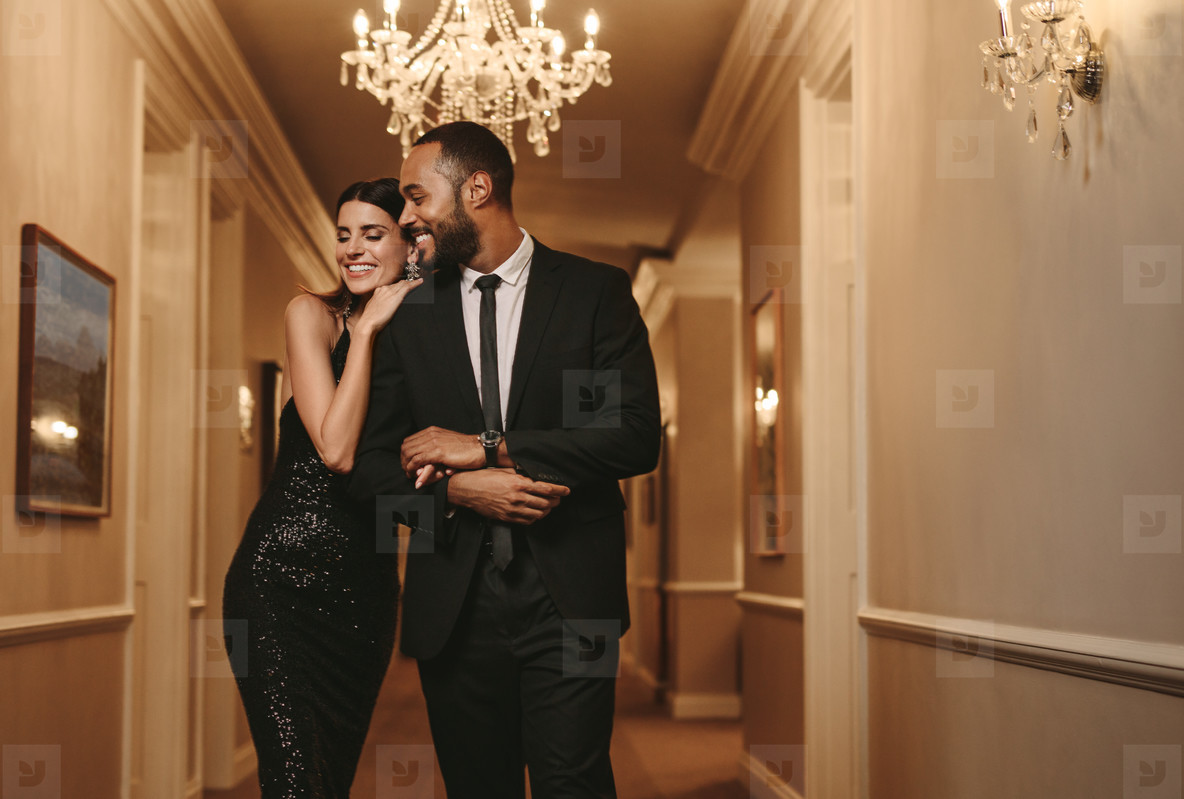 Beautiful couple in formalwear at a party