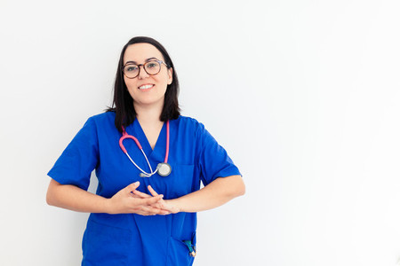 Doctor woman isolated on withe background gesturing and smiling