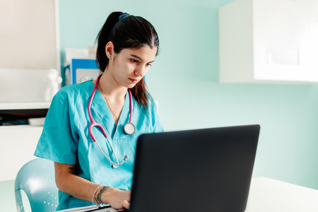 Female doctor using the laptop in the clinic