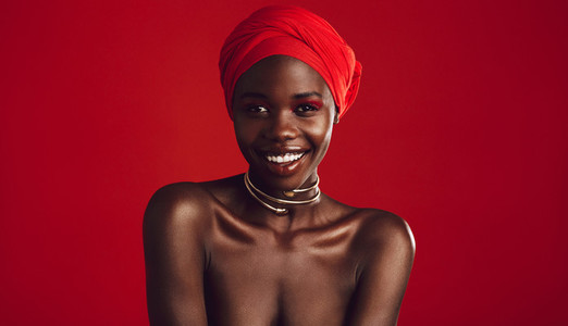 Attractive african woman on red background