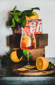 Aperol Spritz cocktail in glass with eco friendly straw on board
