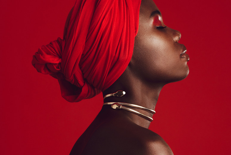 Profile view of attractive woman wearing a red turban