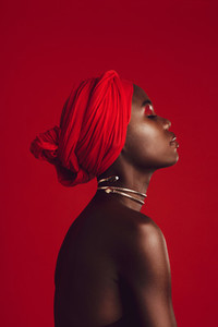 Profile view of attractive woman wearing a red turban