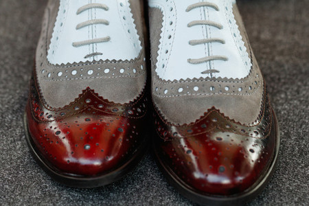 Close up of patent leather shoes brogues