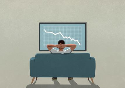 Man on sofa watching stock market decline on TV