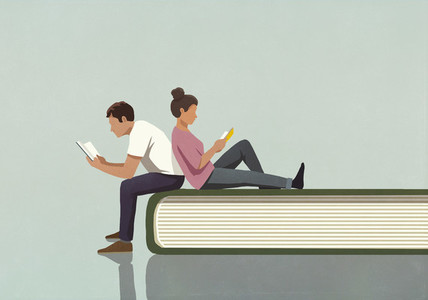 Couple reading books on large book