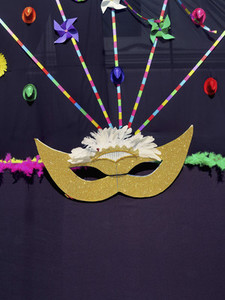 Masquerade mask and pinwheel decorations