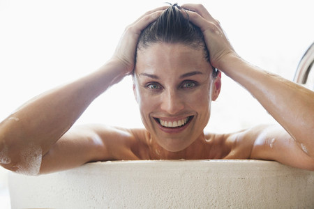 Portrait happy woman enjoying bath