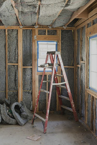 Ladder and insulation in house under construction