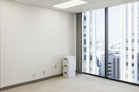 Boxes on floor in empty urban highrise office