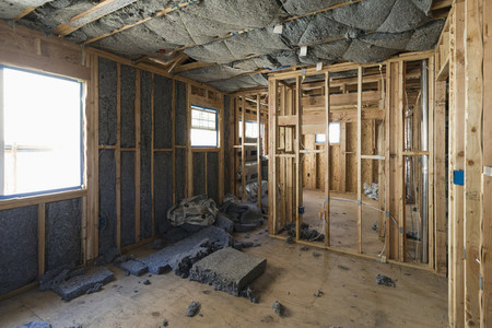 Insulation being installed in house under construction