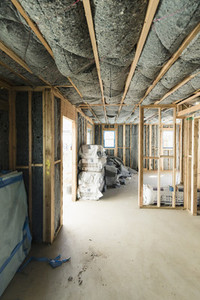 Insulation being installed in house under construction