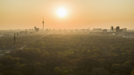 Golden sunset over Berlin cityscape and Volkspark Friedrichshain park
