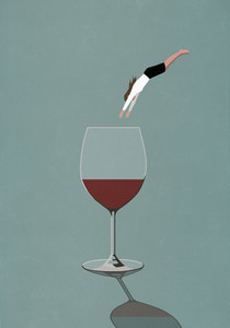 Businesswoman diving into large glass of wine
