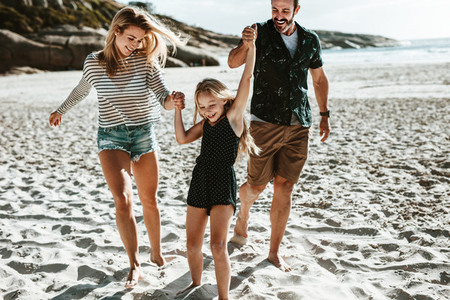 Family enjoying quality time on the beach
