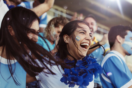 Argentina soccer fans cheering during a match in stadium
