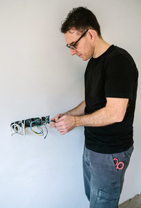 Electrician working on the electrical installation of a house