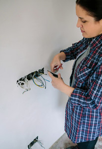 Electrician working on the electrical installation of a house