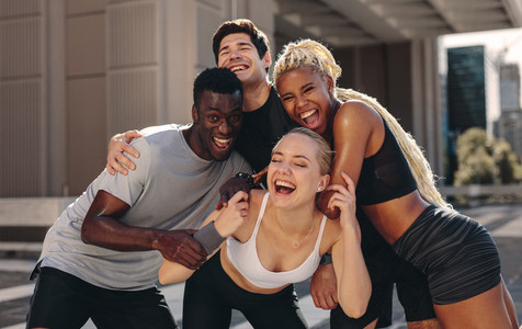 Cheerful fitness group outdoors