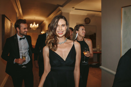 Beautiful woman with friends at gala night