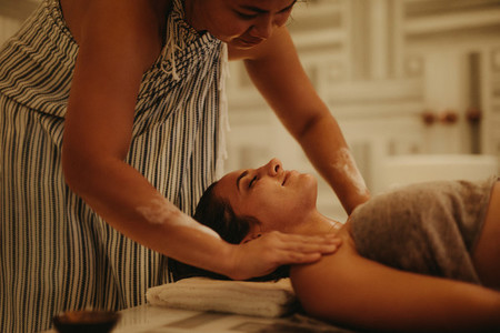 Woman enjoying massage at a spa