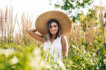Young cheerful woman wearing hat