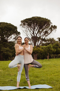 Friends doing yoga together