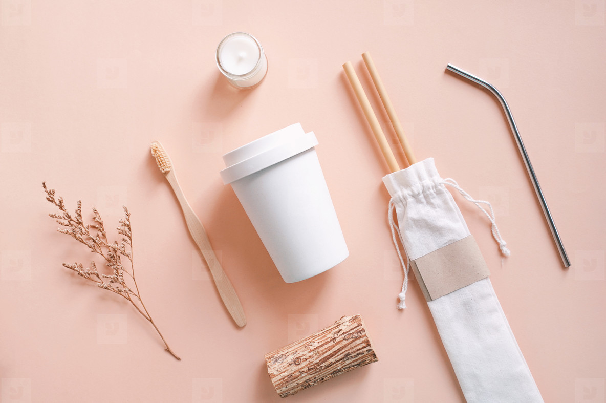 Flat lay of sustainable products, bamboo toothbrush, straw in sa