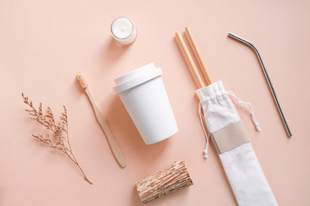 Flat lay of sustainable products  bamboo toothbrush  straw in sa