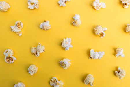 Popcorn on yellow color background minimal food