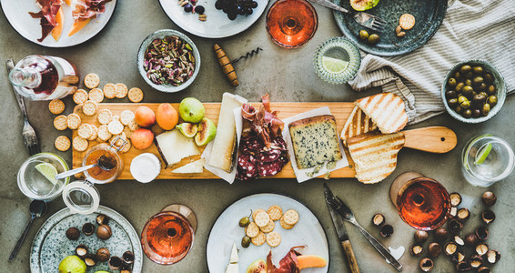Seasonal picnic with rose wine cheese charcuterie nuts and fruits