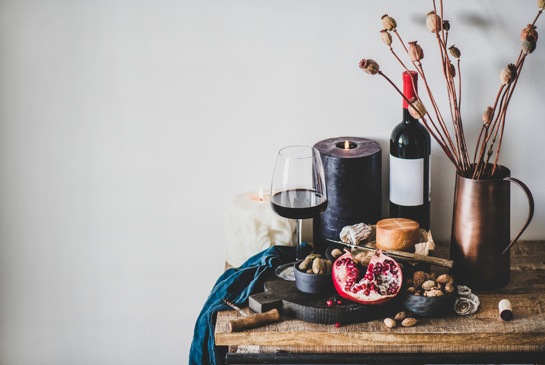 Red wine and different snacks on wooden board  copy space
