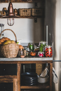 Fresh ingredients and glass jars with homemade vegetables preserves