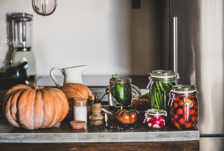 Ingredients for cooking and glass jars with homemade vegetables preserves