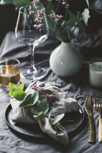 Festive table setting with floral decor  The concept of Thanksgiving or wedding dinner