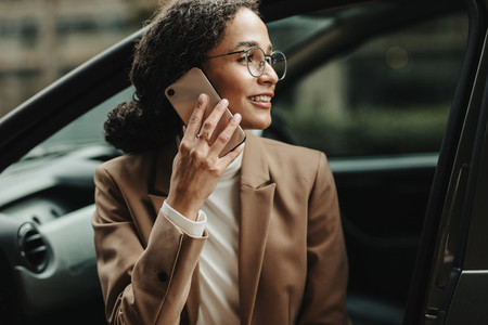 Businesswoman in car making a phone call