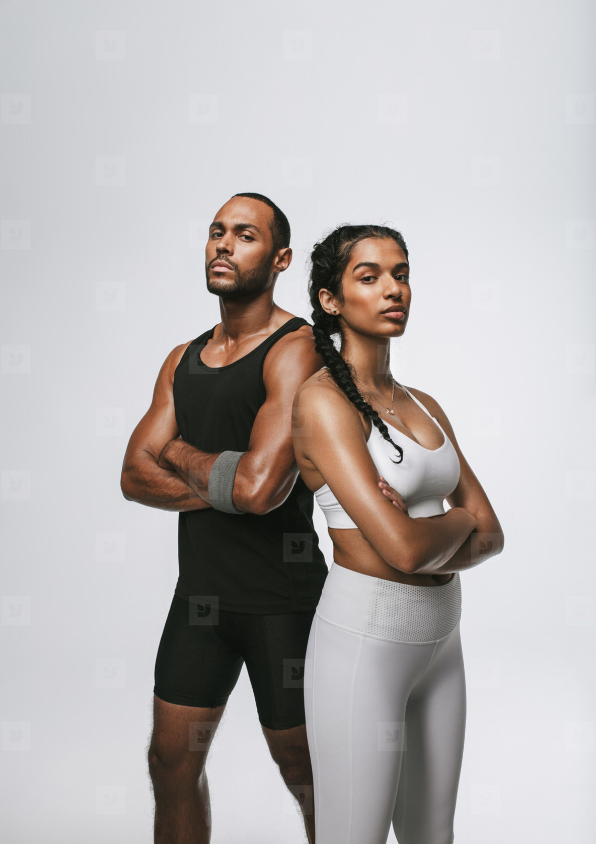 Gym couple standing arms crossed