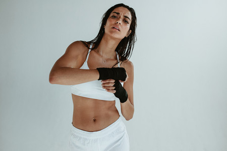 Female boxer wearing hand wraps