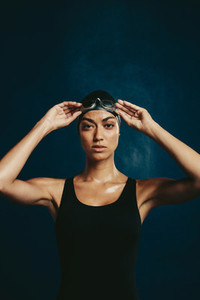Confident woman in swimming costume