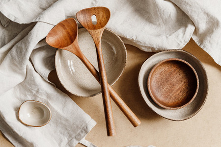 Modern minimalist ceramics set over a linen cloth  Natural products or food concept  top view  flat lay
