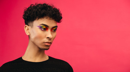 Gender fluid male with rainbow eye makeup