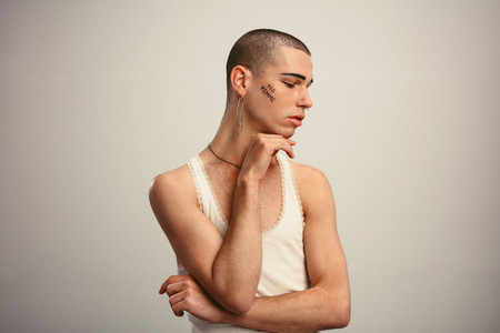 Gender fluid man wearing earring
