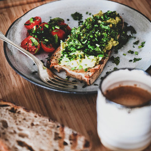 Healthy breakfast with avocado toast and coffee  square crop