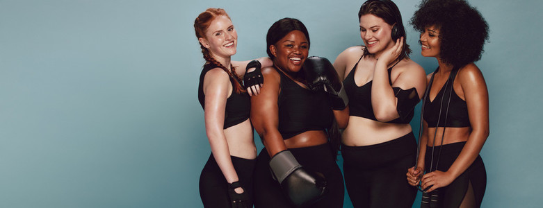 Women of different race and body size in sportswear