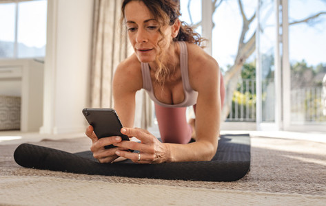 Woman using fitness apps for workout