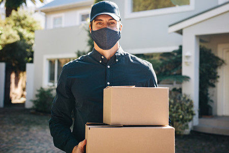 Delivery man delivering online shopping order
