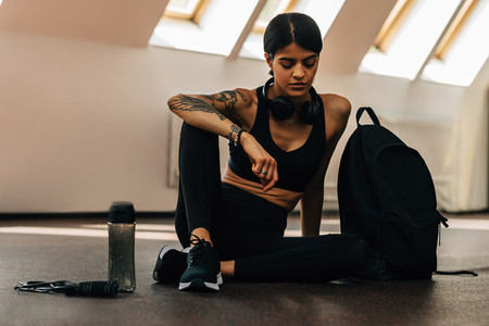 Fit woman resting after training