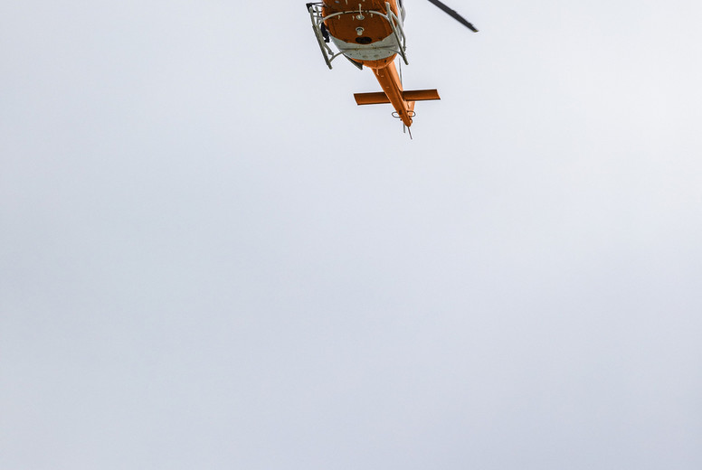 Rescue helicopter flying in sky