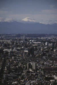 Mount Fuji over sunny Tokyo cityscape Japan